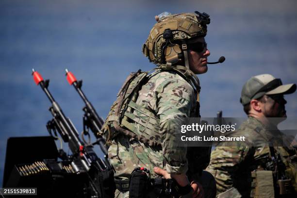 Navy Special Warfare Combatant-Craft Crewmen are pictured aboard a Special Operations Craft Riverine boat before participating in a capabilities...