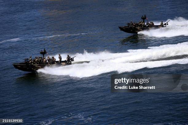 Navy Special Warfare Combatant-Craft Crewmen ride aboard a Special Operations Craft Riverine boat during a capabilities demonstration at Special...