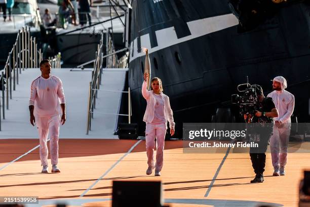 Florent MANAUDOU, French rapper Julien MARI aka JUL carrying the Olympic torch, Nantenin KEITA during the welcoming ceremony for the flame of Olympic...