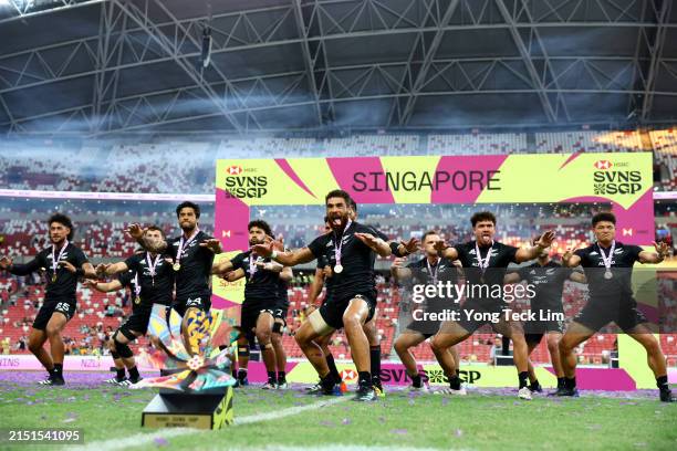 New Zealand players perform the haka after defeating Ireland in the men's cup final during day three of the HSBC SVNS Singapore at the National...