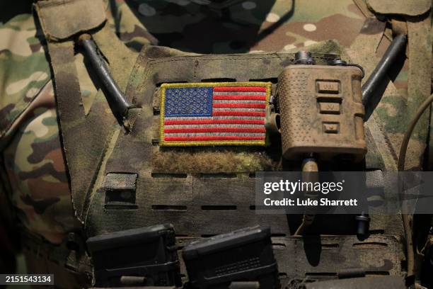 Navy Special Warfare Combatant-Craft Crewman wears a U.S. Flag patch during a capabilities demonstration at Special Operations Forces Week at the...