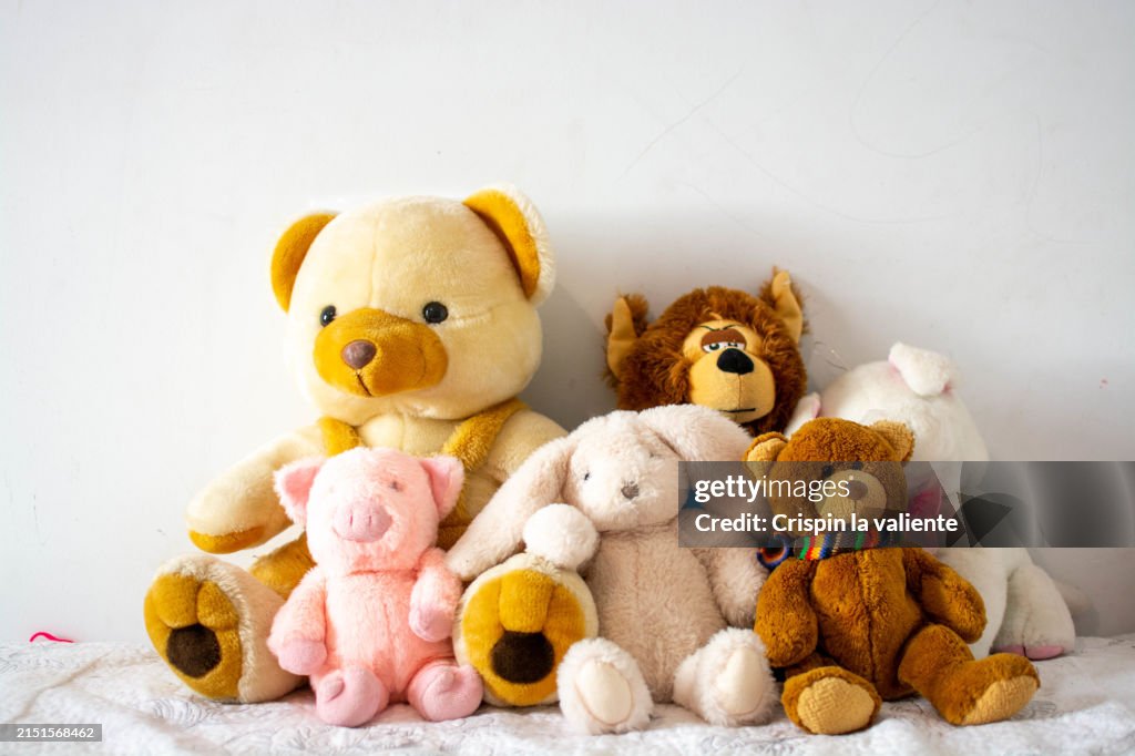 Collection of teddy bears on the bed, children's room