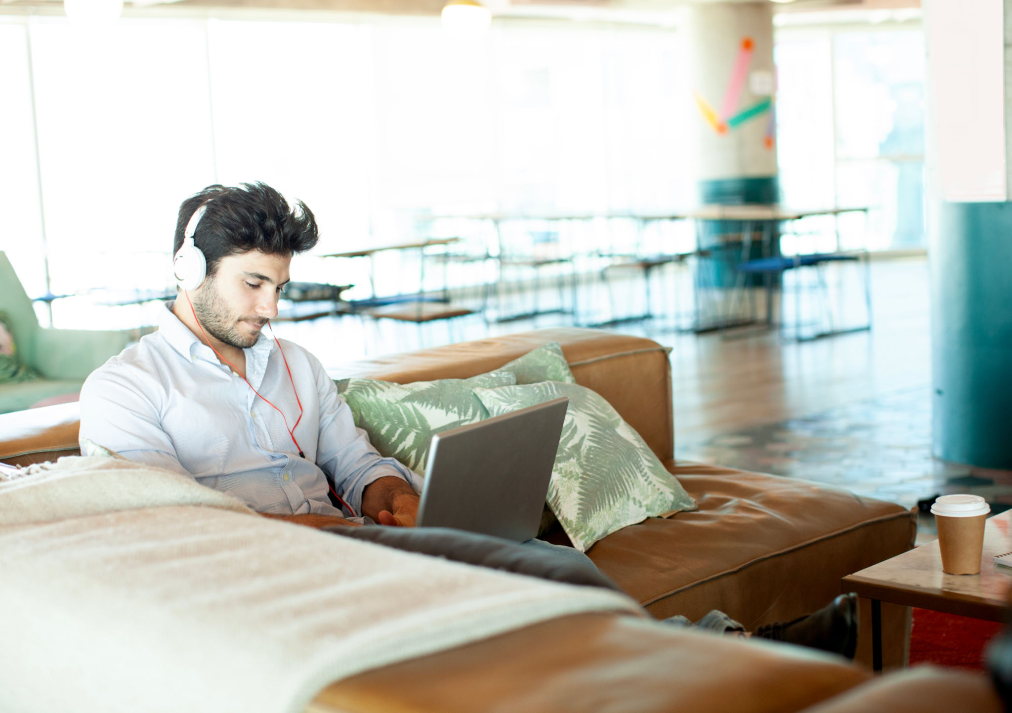 Young man working with computer indoors Young man working with computer indoors