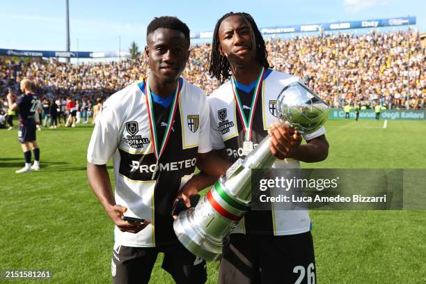 Drissa Camara of Parma Calcio 1913 and Woyo Coulibaly of Parma Calcio 1913 celebrate the victory of Serie B during the Serie B match between Parma...