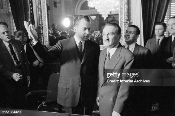 American Vice President Richard Nixon , center left, gestures while speaking with Soviet politician and First Deputy Chairman of the Council of...