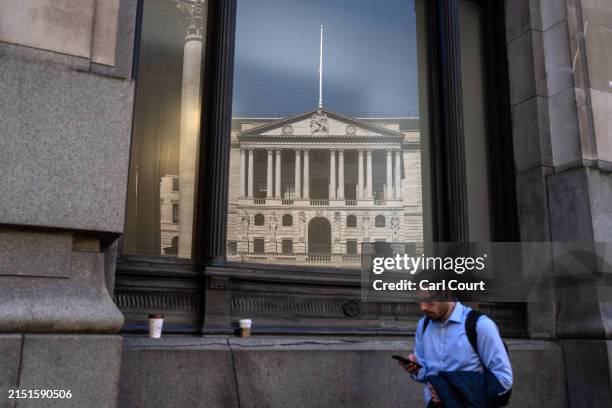 The Bank of England is reflected in the window of a nearby building on May 9, 2024 in London, England. The Bank of England publishes the UK Monetary...