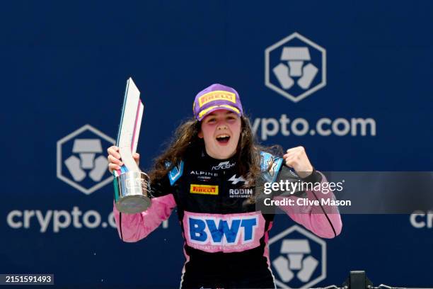 Race winner Abbi Pulling of Great Britain and Rodin Motorsport celebrates on the podium during Round 2 Miami race 2 of the F1 Academy at Miami...