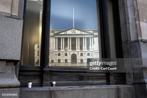 The Bank of England is reflected in the window of a nearby building on May 9, 2024 in London, England. The Bank of England publishes the UK Monetary...