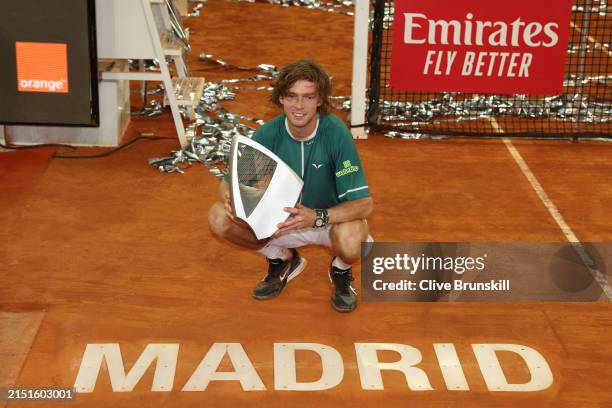 Andrey Rublev poses with the Mutua Madrid Open trophy following victory in the Men's Singles Final match against Felix Auger-Aliassime of Canada on...