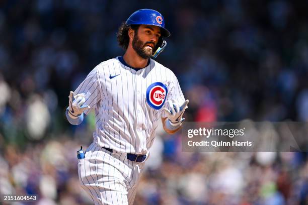 Dansby Swanson of the Chicago Cubs reacts after his home run in the sixth inning against Freddy Peralta of the Milwaukee Brewers at Wrigley Field on...