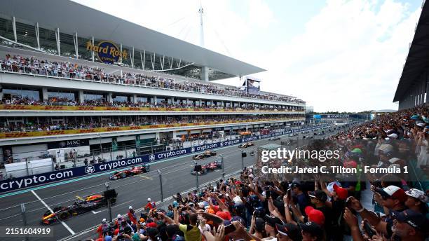 Max Verstappen of the Netherlands driving the Oracle Red Bull Racing RB20 leads the field off the line at the start during the F1 Grand Prix of Miami...