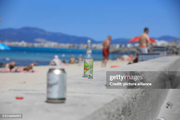 May 2024, Spain, Palma: Empty bottles and cans can be seen on Arenal beach. Photo: Clara Margais/dpa