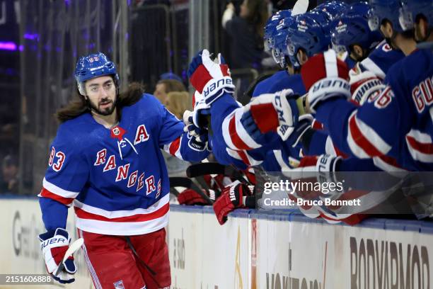 Mika Zibanejad of the New York Rangers celebrates with his teammates after scoring a goal against the Carolina Hurricanes during the first period in...