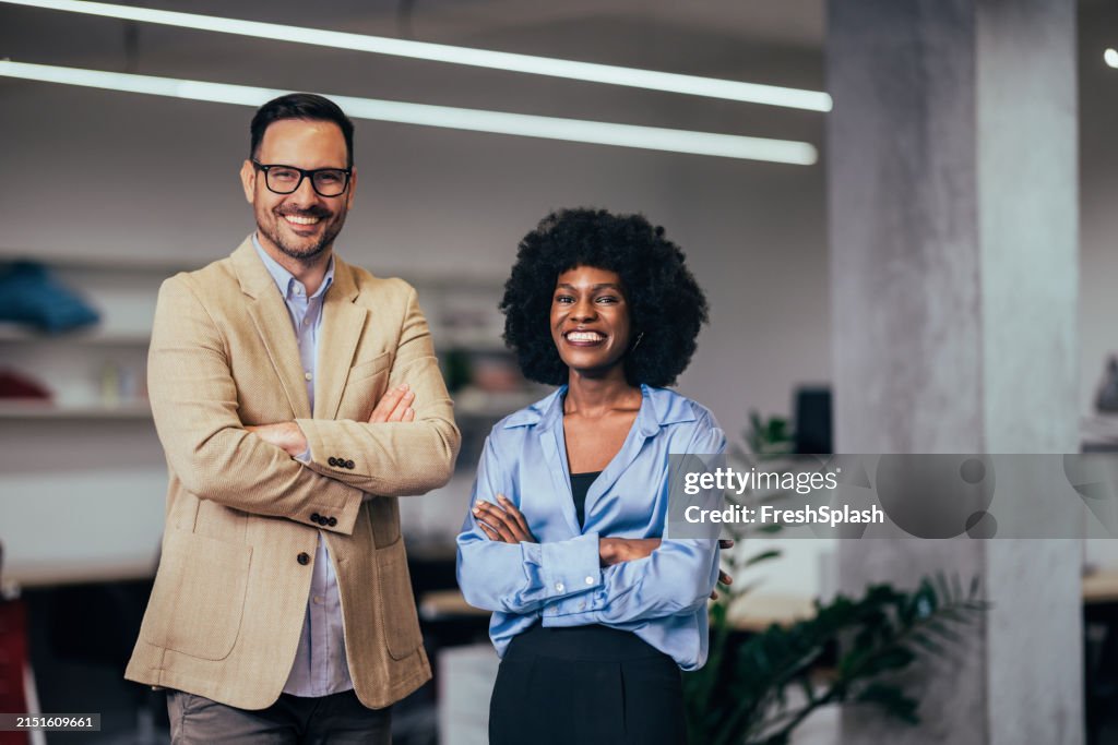 Confident Business Professionals Smiling in Modern Office