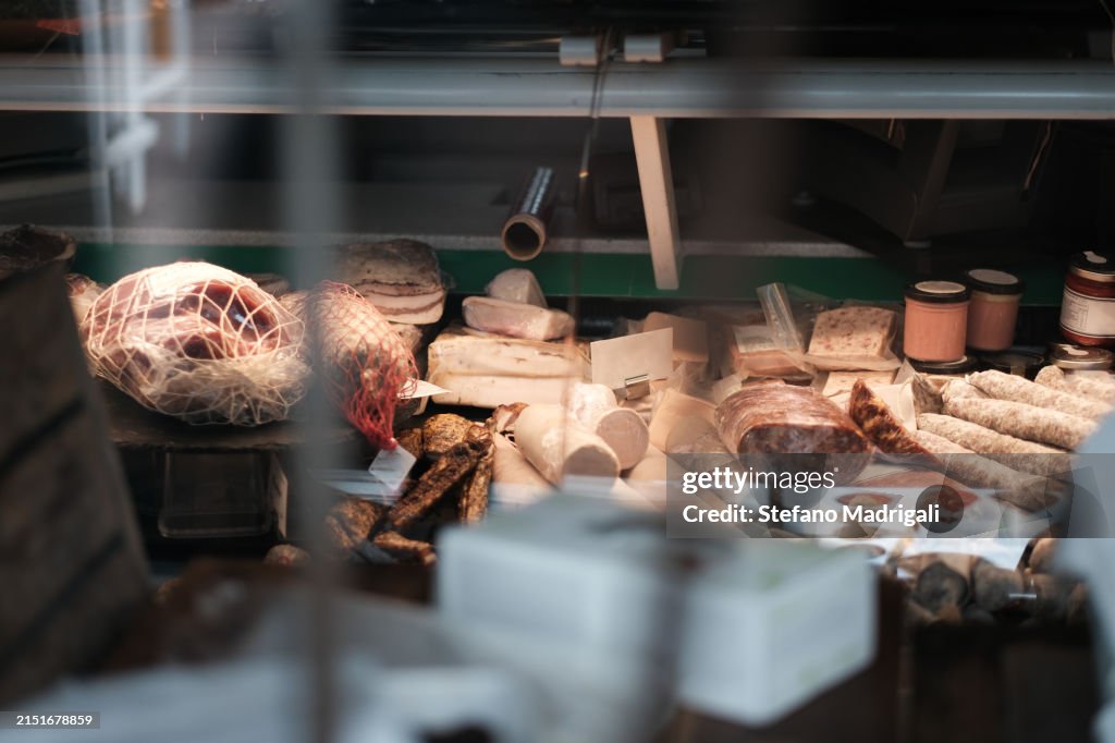 Cold cuts and cheeses inside the showcase on display, market