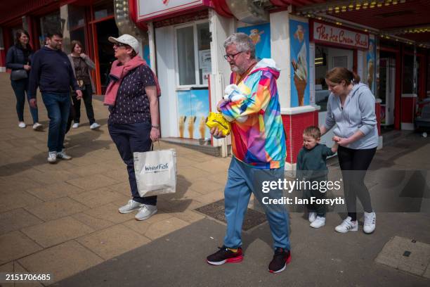 Visitor carries a cuddly toy as he visits Scarborough on May 06, 2024 in Scarborough, England. The early May Day bank holiday was inaugurated in the...