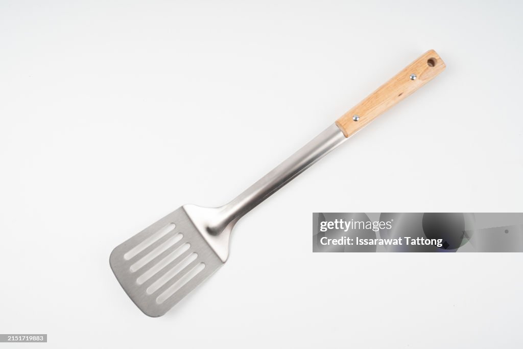Kitchen spatula with wooden handle isolated on white background