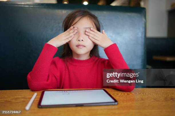 electronic products harm children’s vision - rubbing eyes stock pictures, royalty-free photos & images