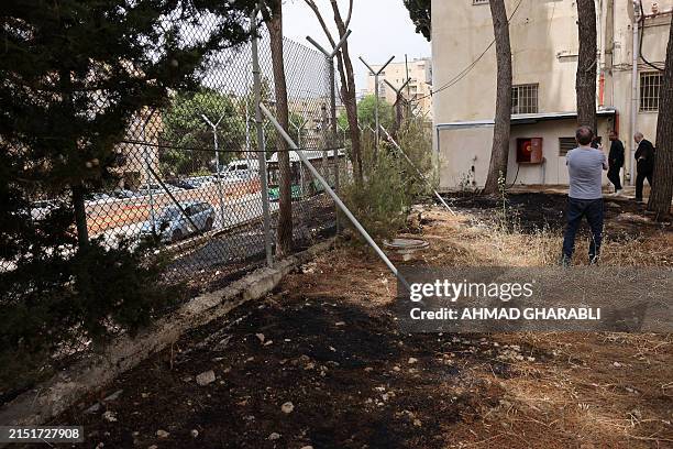 United Nations Relief and Works Agency for Palestine Refugees personnel visit their headquarters in east Jerusalem where the traces of a fire are...