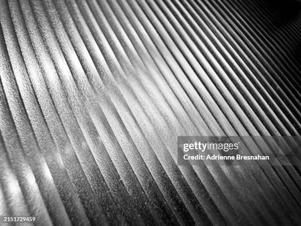 rippled metal texture - platino fotografías e imágenes de stock