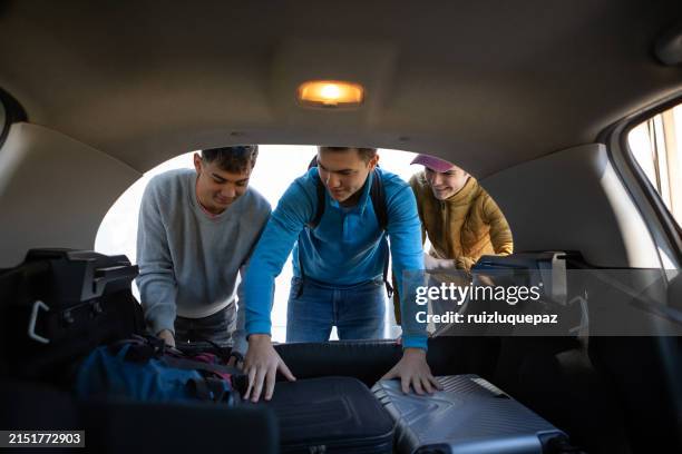 People Loading Luggage 42 Laughing Friends Loading Luggage Into Car Stock Photos, High-Res ...