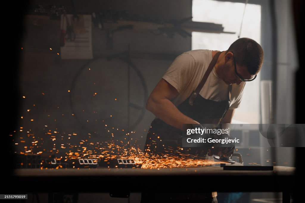 Metalworker Grinding Steel