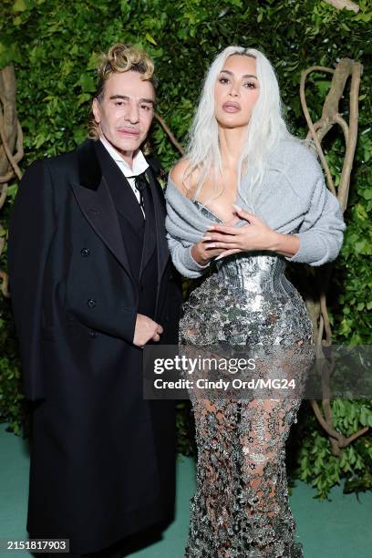 John Galliano and Kim Kardashian attend The 2024 Met Gala Celebrating "Sleeping Beauties: Reawakening Fashion" at The Metropolitan Museum of Art on...