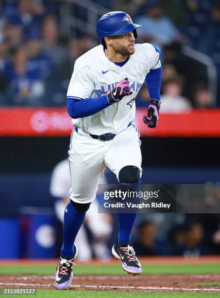George Springer of the Toronto Blue Jays runs to first base during a game against the Kansas City Royals at Rogers Centre on May 01, 2024 in Toronto,...