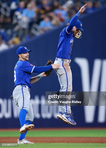 Michael Massey and Bobby Witt Jr. #7 of the Kansas City Royals celebrate the win following a game against the Toronto Blue Jays at Rogers Centre on...