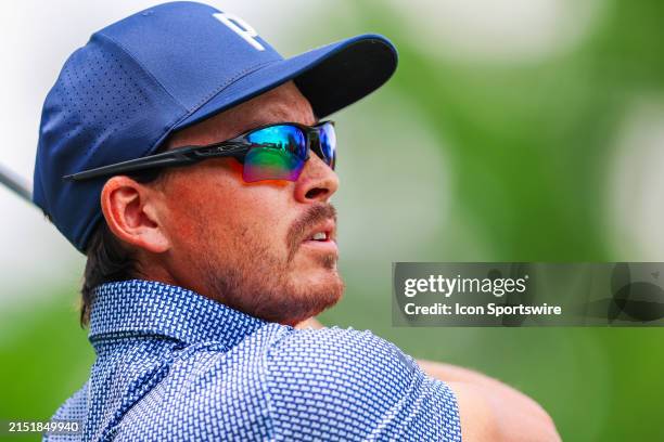 Rickie Fowler watches his shot from the fourth tee box during the second round of Wells Fargo Championship at Quail Hollow Club on May 10, 2024 in...