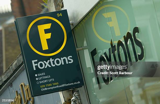 Foxtons real estate agents shop is shown July 10, 2003 in London, England. House price growth slowed in June but the property market remains well...