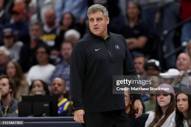 Assistant coach Micah Nori of the Minnesota Timberwolves watches as his team plays the Denver Nuggets in the first quarter during Game Two of the...