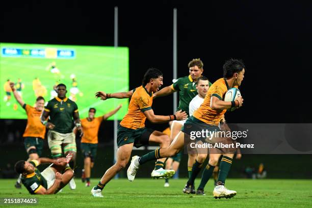 Shane Wilcox of Australia makes a break before scoring a try during The Rugby Championship U20 Round 2 match between Australia and South Africa at...