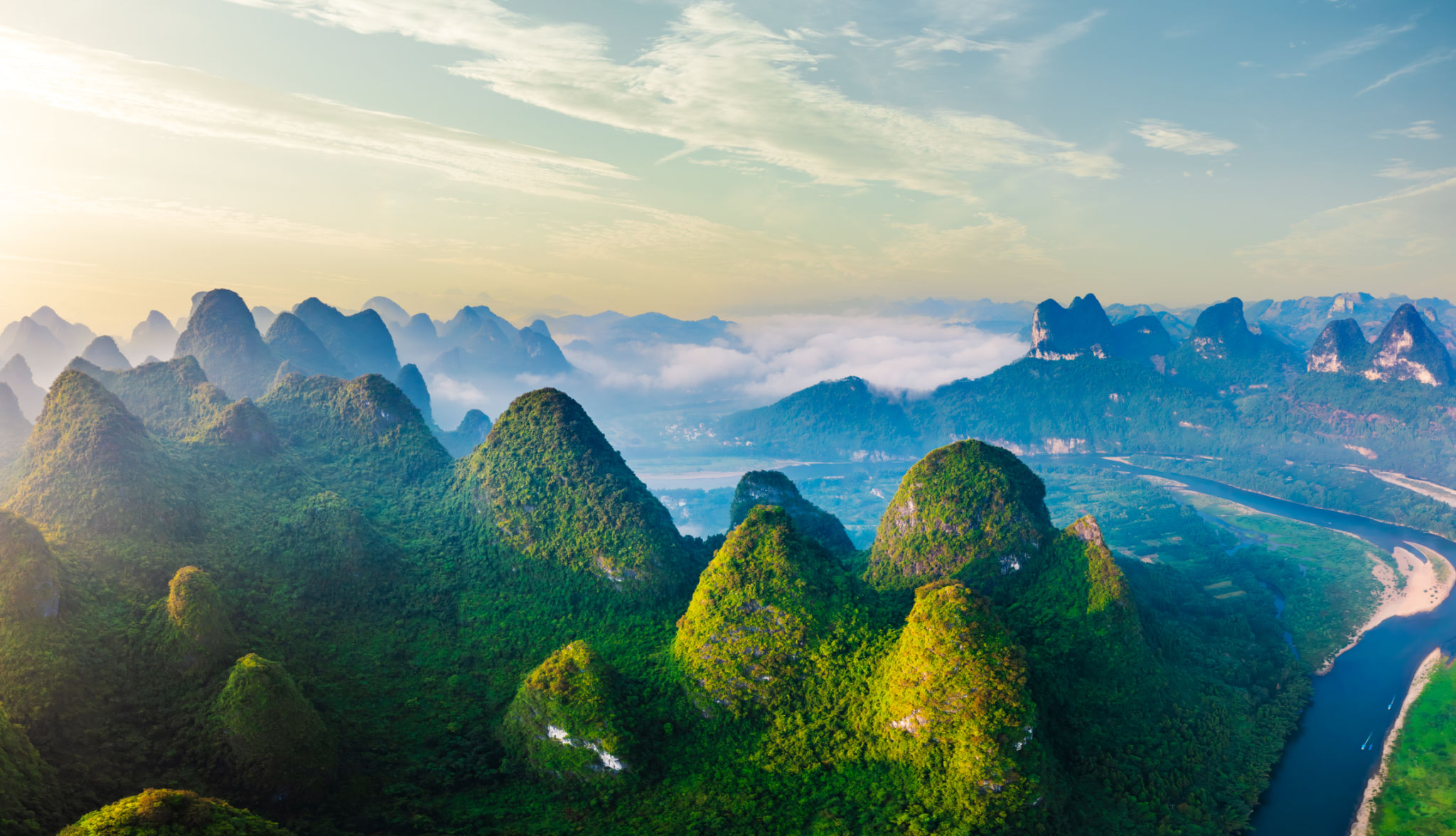 Aerial view of the beautiful karst mountains and sky clouds natural landscape at sunrise in Guilin, China. Aerial view of the beautiful karst mountains and sky clouds natural landscape at sunrise in Guilin, China.