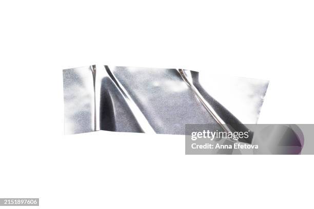 festive silver metallic wrinkled adhesive tape. festive design element for multiple types of graphic design decorations. isolated on white background, cut out. textured, high resolution - sticky stock pictures, royalty-free photos & images
