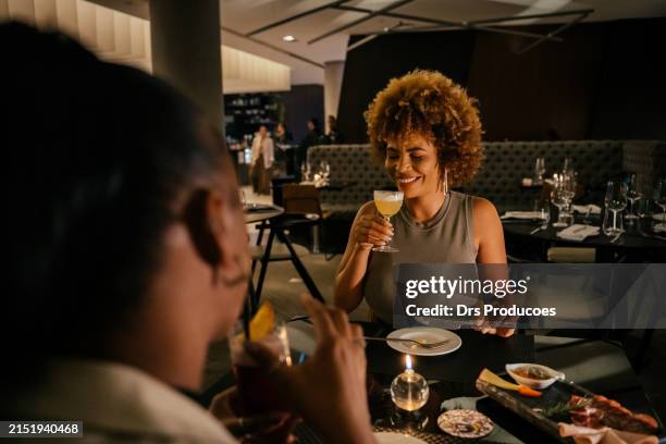 business women at happy hour in hotel restaurant - luxury restaurant imagens e fotografias de stock