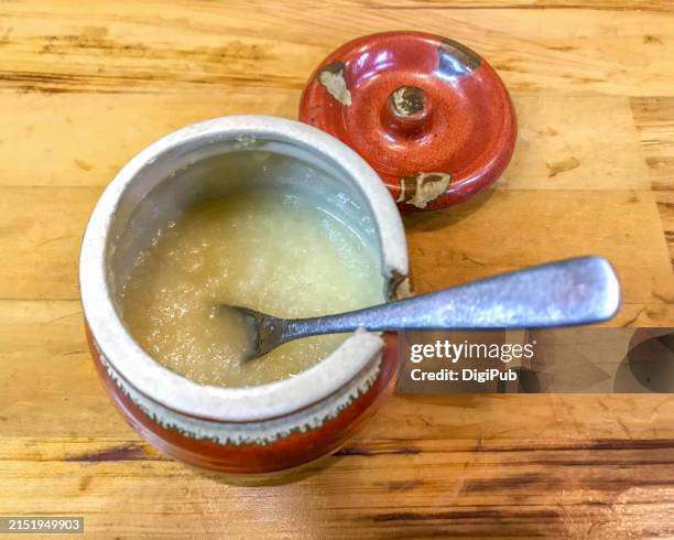 freshly grated garlic in traditional pot - grated metal stock pictures, royalty-free photos & images