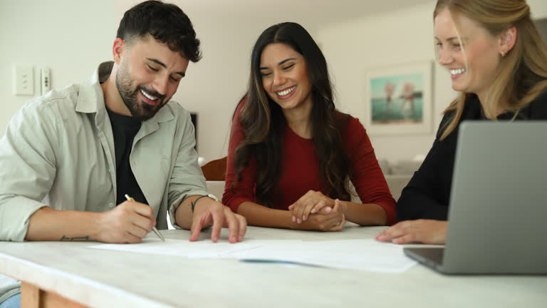 https://media.gettyimages.com/id/2151953115/video/real-estate-or-insurance-agent-or-lawyer-with-couple-signing-home-loan-mortgage-or-contract.jpg?b=1&s=640x640&k=20&c=JMzNh7UjSpGgqipZGpDk6ANA1X1Omkhq1IzYkprBVY4=