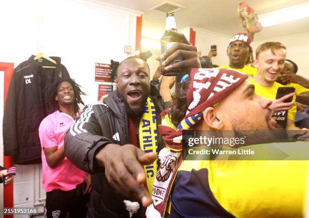 Stormzy, British Rap artist and co owner of AFC Croyden Athletic celebrates promotion with the AFC Croyden Athletic players in the changing room...