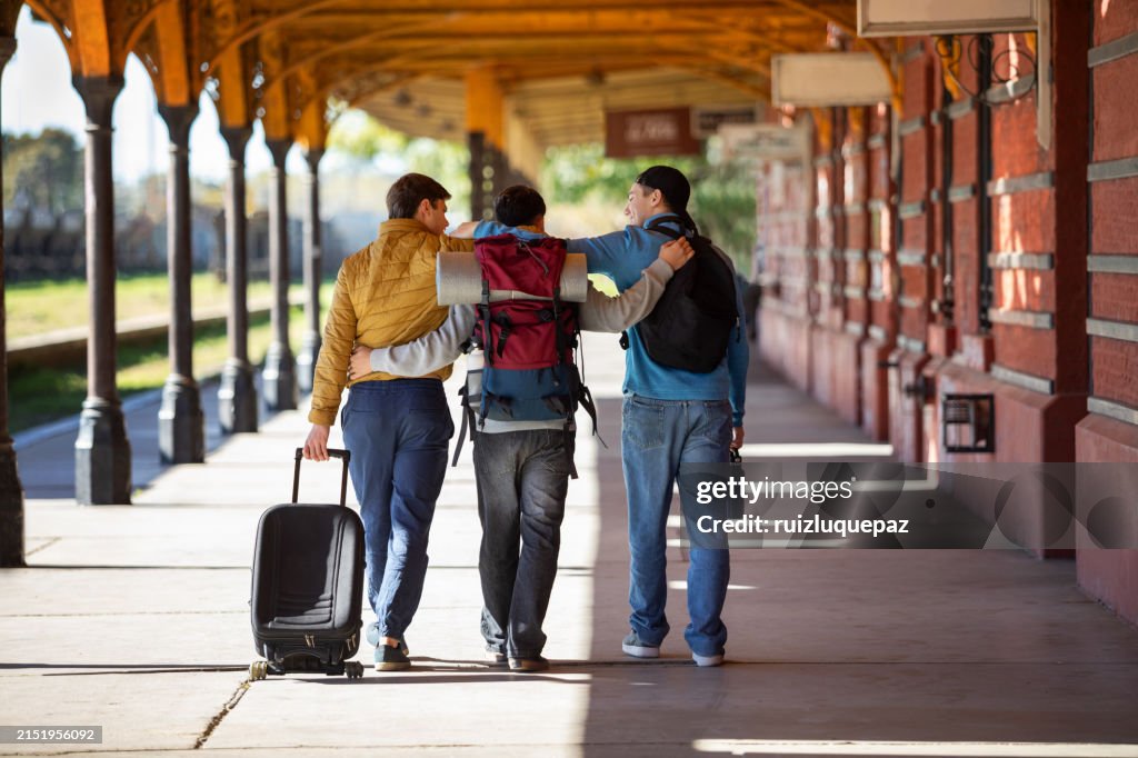 Friends Catching Train Teenage Friends Waiting For The Train At The Train Station High-Res ...