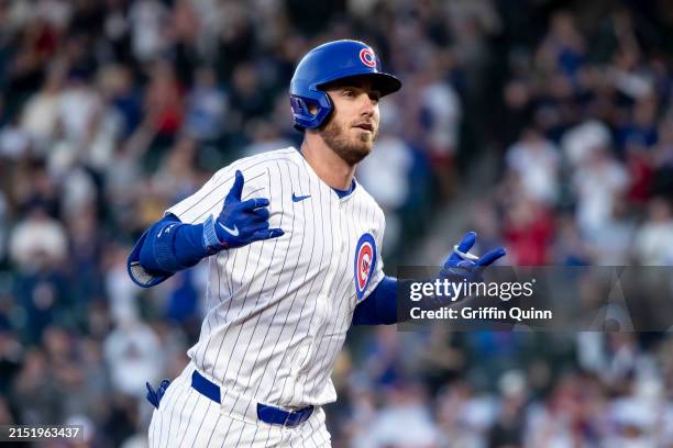 Cody Bellinger of the Chicago Cubs rounds the bases for a solo home run in the fourth inning against the San Diego Padres at Wrigley Field on May 07,...