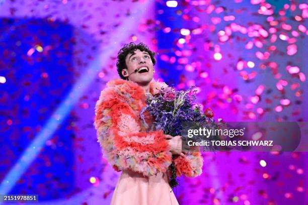 Swiss singer Nemo representing Switzerland with the song "The Code" celebrates on stage after winning the final of the 68th Eurovision Song Contest...