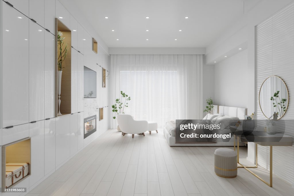 Side View Of Modern Bedroom Interior With Dressing Table, Double Bed, Television Set And Armchair
