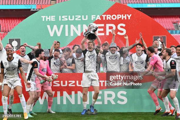 The Gateshead team is lifting the trophy during the Isuzu FA Trophy Final between Gateshead and Solihull Moors at Wembley Stadium in London, on May...