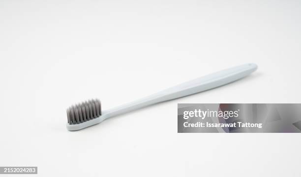 tooth brush isolated on a white background - toothbrush stock pictures, royalty-free photos & images