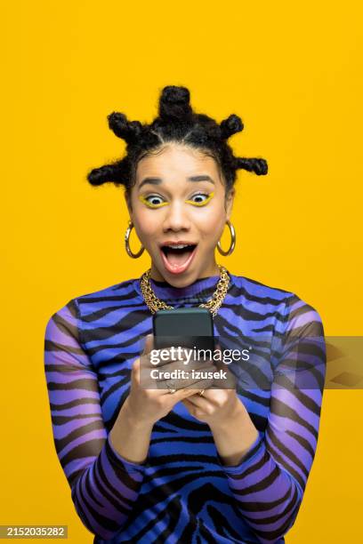 surprised gen z teen girl using smart phone - excitement stock pictures, royalty-free photos & images
