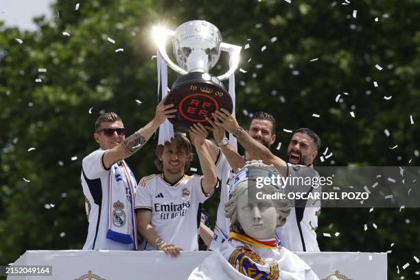 Real Madrid's German midfielder Toni Kroos, Real Madrid's Croatian midfielder Luka Modric, Real Madrid's Spanish defender Nacho Fernandez and Real...