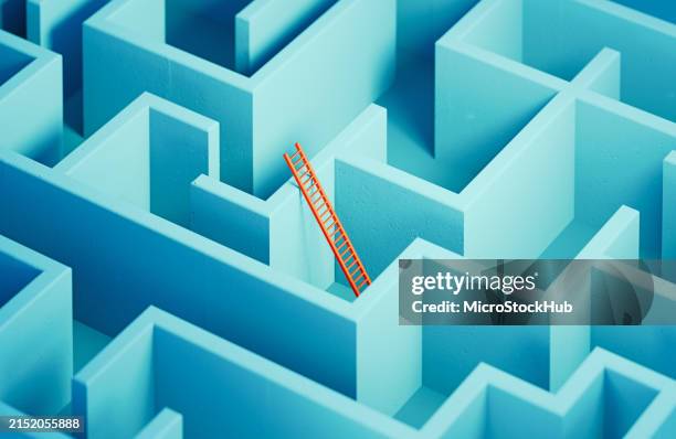 red colored ladder inside a blue maze - solution concept - labirinto imagens e fotografias de stock