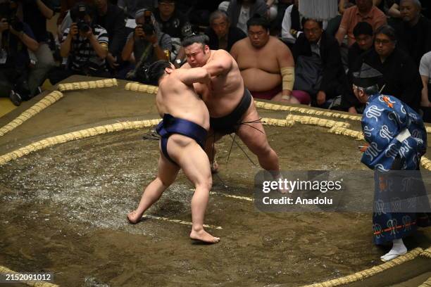 Sumotori wrestlers Takakeisho and Hiradoumi of Makuuchi compete during the 17th fight of the first day of the Grand Sumo Tournament at Tokyo's...