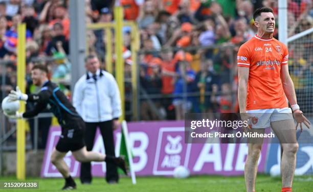 Monaghan , Ireland - 12 May 2024; Shane McPartlan of Armagh reacts after his penalty was saved by Donegal goalkeeper Shaun Patton, behind, for the...